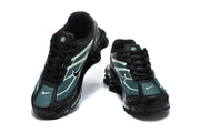Front view of a pair of Nike Shox Ride 2 sneakers in black, teal, and pale green.