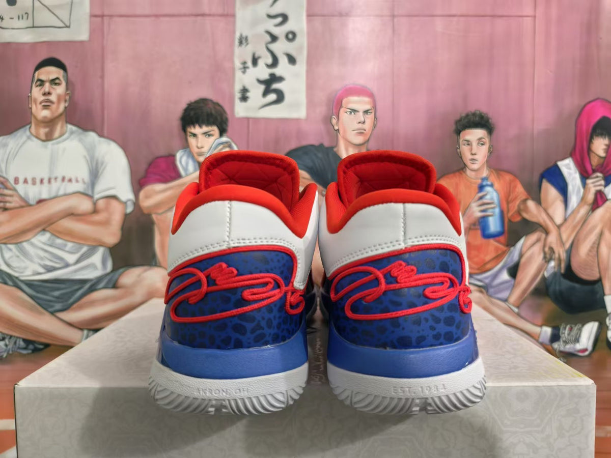 Rear view of white, blue, and red Nike basketball shoes with patterned blue heel panels.