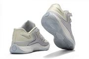 White and silver Nike KD 18 sneakers showing the rear and outsole.