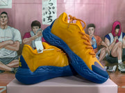 Angled side view of the sneakers showing the low-cut profile, textured blue outsole, and yellow upper.