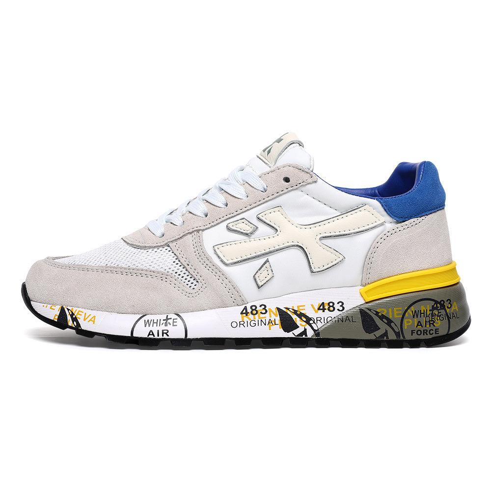 Side view of a white and gray Premiata low-top sneaker with a blue heel accent, yellow midsole detail, and graphic sole.
