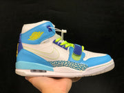 Side profile of the light-blue and white sneaker with elephant-print overlay and visible heel window.