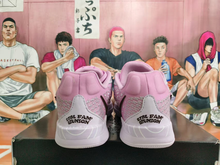 Rear view of pink and light gray basketball shoes with heel lettering