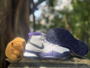 Pair of white and purple high-top sneakers shown from the side and outsole angles.