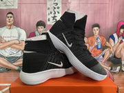Pair of black high-top Nike basketball sneakers with white Swoosh logos and white ridged soles, shown from the side.