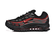 Side view of a black sneaker with red and silver accents and visible cushioning windows.