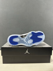 Outsole view showing translucent blue rubber with blue traction sections and a visible carbon-patterned midfoot panel.