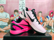 Angled view of the pair highlighting the pink, white, and black color blocking and side branding.