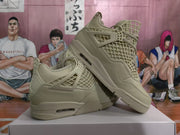 Angled view of warm yellow Jordan sneakers showing the mesh side panels, lace wings, sculpted midsoles, and heel air windows.