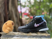 Angled side view showing the black high-top shoe, patterned side detail, and multicolor collar.