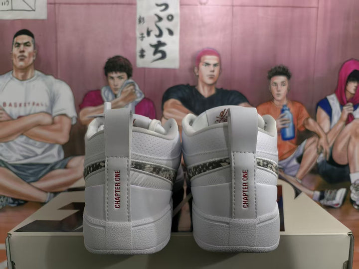 Rear view of white Nike sneakers showing the patterned side detail, heel pull tabs, and “CHAPTER ONE” text.