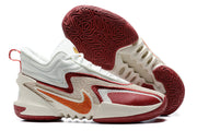 White Nike Anthony Edwards 2 basketball shoes with burgundy and orange accents.