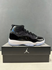 Side profile of a single black and blue high-top sneaker placed on a Jordan shoebox.