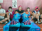 Front view of blue high-top sneakers with turquoise laces and a multicolor printed upper
