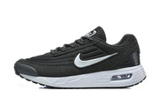 Side view of a black Nike Air Max Verse sneaker with a white Swoosh and white midsole.
