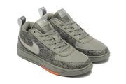 Angled view of the grey patterned Nike Book 1 shoes