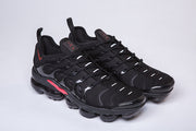 Pair of black and red TN-3 sneakers viewed from the front and side.