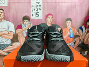 Front view of black Nike basketball shoes with grey laces and toe details