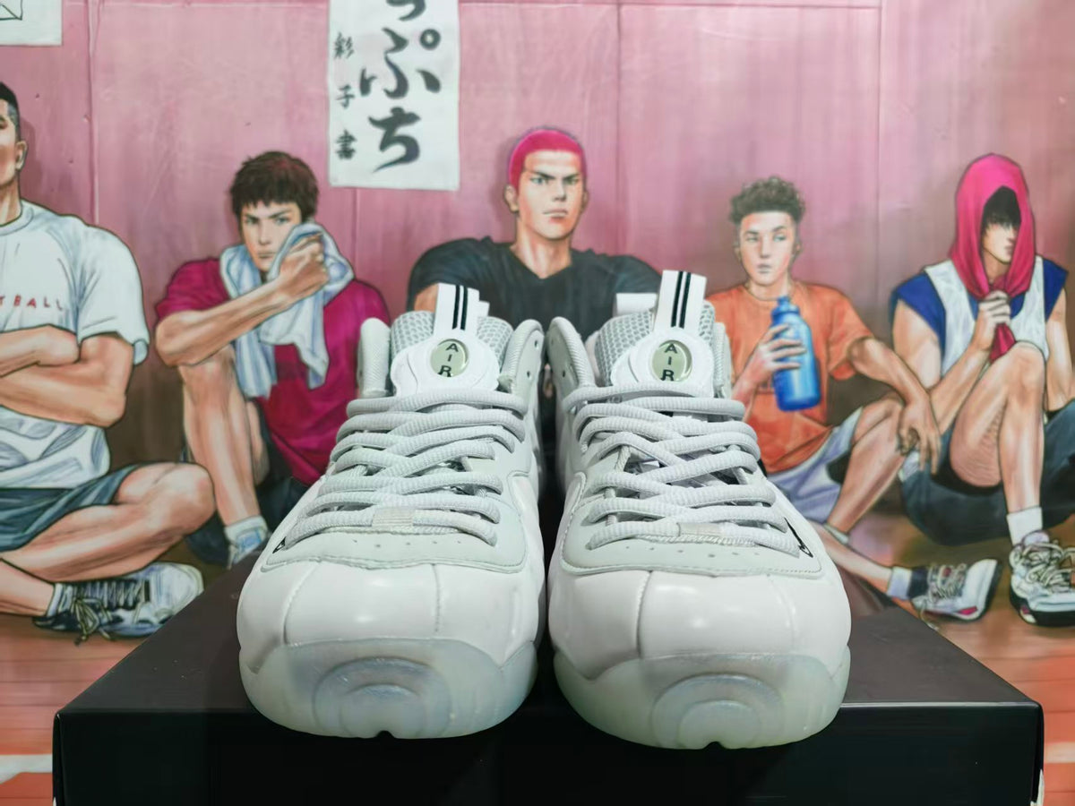 Front view of white Nike Foamposite basketball sneakers