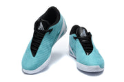 Top view of turquoise Nike sneakers showing black laces and logo tongues.