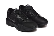 Three-quarter front view of the black low-top sneakers with black laces, perforated overlays and tonal branding.