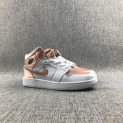 Front three-quarter view of the white and rose-gold lace-up sneakers.
