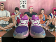 Front view of purple and magenta Nike basketball shoes with white laces and blue and pink accents.