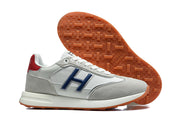 Side and outsole views showing blue side accents and gum-colored tread.