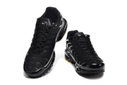 Pair of black Nike Air Max Plus sneakers shown from the front.