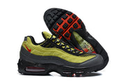 Side view of green and anthracite Nike Air Max 95 TT sneakers with the outsole visible