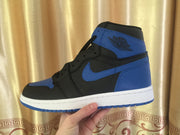 Side profile of one black and royal blue high-top sneaker held against a patterned curtain.