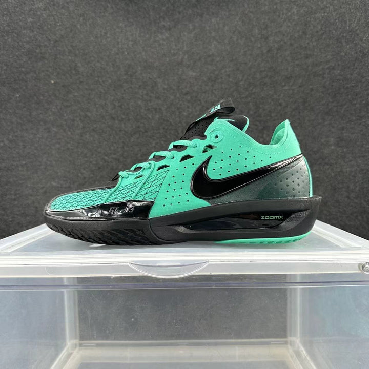 Side view of green and black Nike GT Cut 3 basketball shoes with perforated panels and a patterned forefoot.