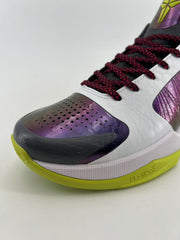Close-up of the perforated purple toe, dark overlay, and burgundy-speckled laces.