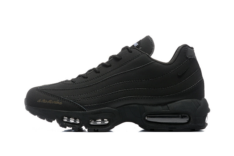Side view of a black Nike Air Max 95 sneaker with layered stitched panels and visible sole air units.