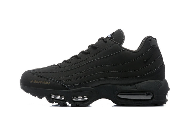 Side view of a black Nike Air Max 95 sneaker with layered stitched panels and visible sole air units.