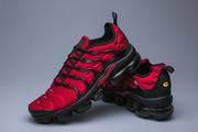 Red and black Nike TN sneakers shown from side and rear.