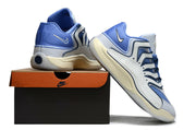 Blue and white Nike KD 18 sneakers arranged with a shoebox.