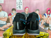 Rear view of Nike basketball shoes with glossy heel panels and speckled midsoles.