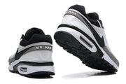 Rear and outsole views highlighting the heel branding and visible Air units.