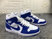 Three-quarter view of the pair displaying the white and blue color blocking and mid-top construction.