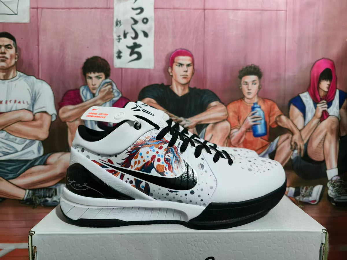 Side view of black-and-white Nike basketball shoes with speckled detailing and a multicolor side graphic.