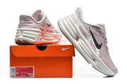 Nike Comfort Ride EasyOn sneaker beside its orange box; the visible box label shows size 8.5