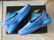 Angled view of the pair showing the blue outsole, translucent heel sections, and black side branding.