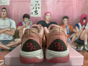 Rear view of a pair of magenta sneakers showing dark heel panels and pink outsole details.