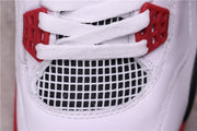 Detailed view of the white mesh panel beneath the white laces and red lace hardware.