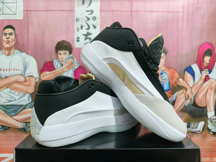 Black and white Jordan basketball shoes shown from the side and rear