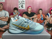 Side view of a pale blue Nike Kobe basketball shoe with a gold Swoosh and translucent blue outsole.