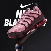 Pink Nike TN-18 sneaker pictured against a dark promotional backdrop.