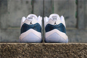 Rear view of the pair showing navy heel panels, white midsoles, and translucent outsoles.