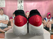 Rear view showing red heel panels, H FLOW markings, and textured white outsoles.